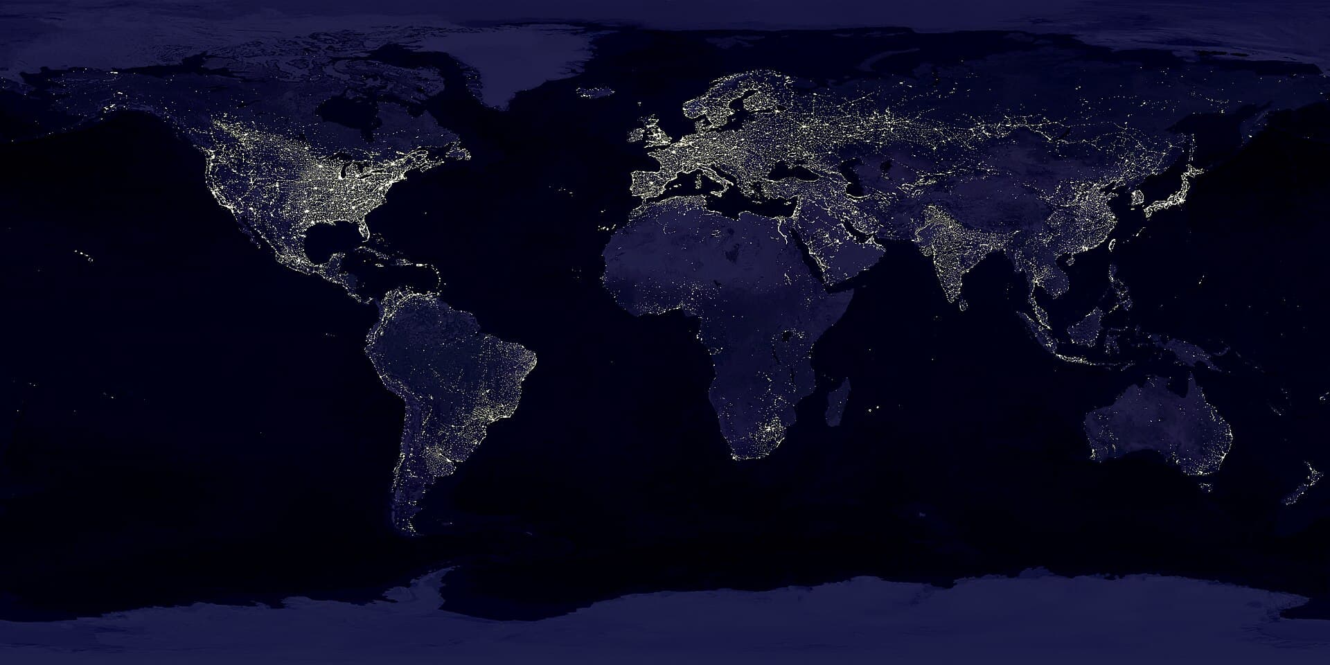 World map at night showing the lights of cities and human settlements